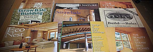 Photo of various books about straw bale home building