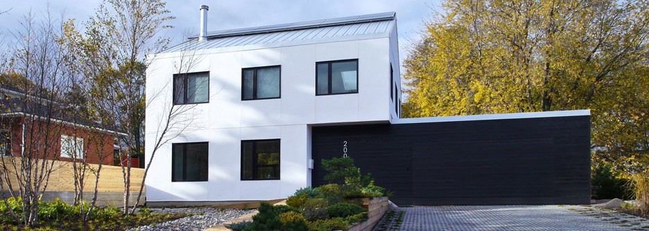Strawbale & shou sugi ban house with green roof